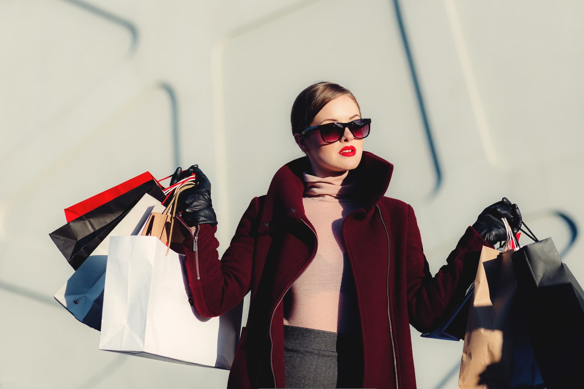 A woman with shopping bags full of clothes